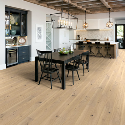 hardwood flooring in kitchen with navy blue cabinets and modern decor