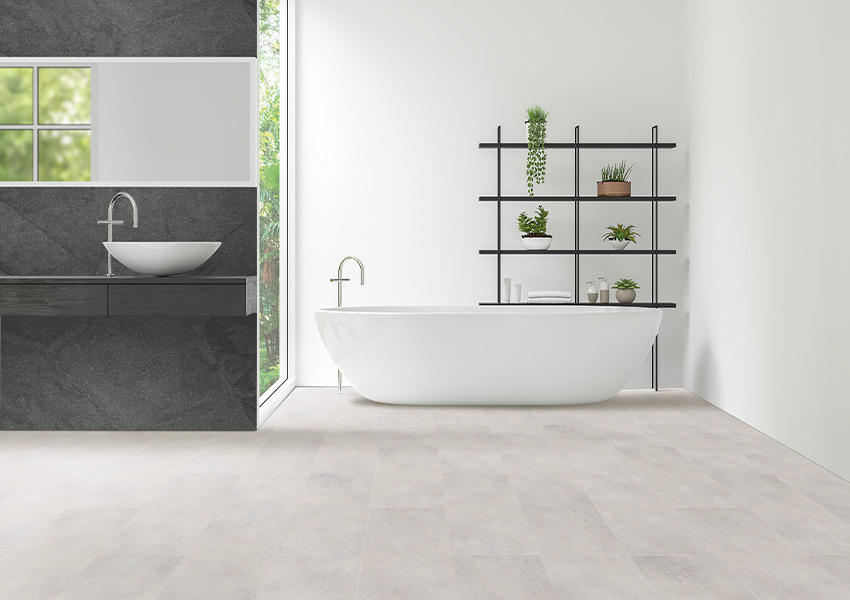 luxury vinyl tile flooring in bathroom with white bathtub